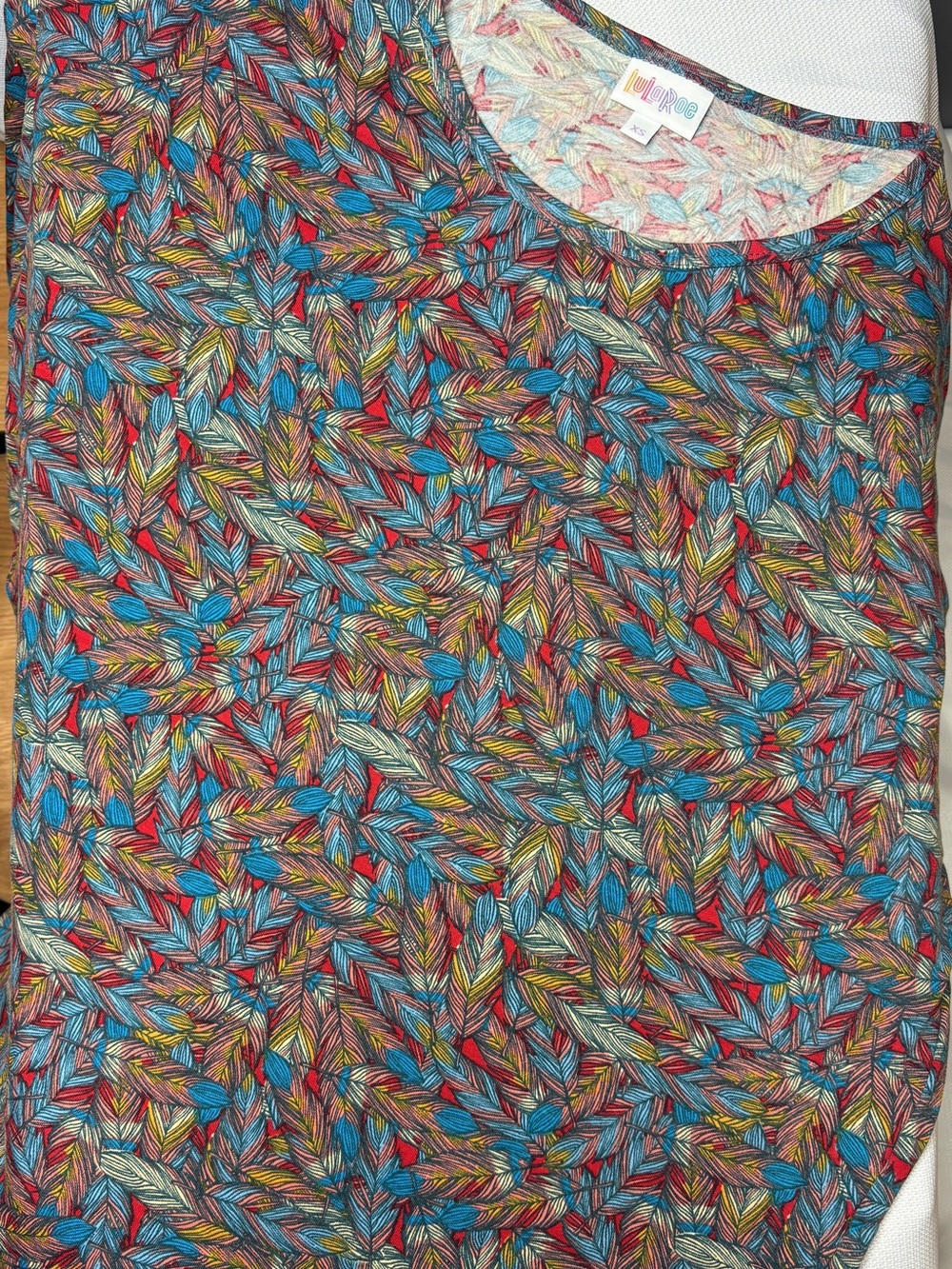 LuLaRoe Irma Leaf-Feather Print tunic in Teal, Red & Yellow